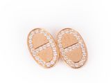 a pair of gold and diamond earrings