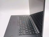 a laptop that is open on a white surface