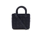 a black handbag on a white background with a strap