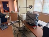 an image of a messy office with a lot of clutter on the desk