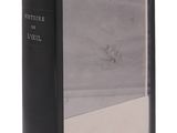 an old black book with a picture of a man in a boat