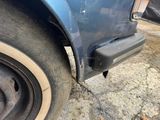a close up of a car ' s tire on the street