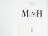 an open book with a black and white logo on it