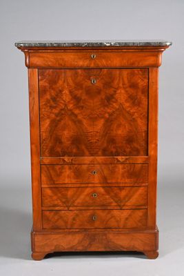 an antique wooden chest of drawers with marble top