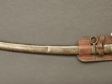 an image of a sword with a leather sheath on it