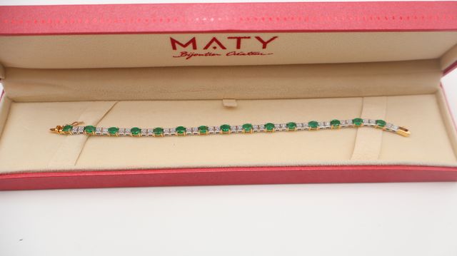 Bracelet en or jaune et blanc 18 carats 750 millièmes à décor de ...