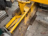 a yellow machine that is sitting on the ground