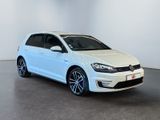 the white volkswagen golf is parked in a white room