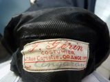 a close up of a black hat with a label on it