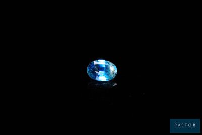 a blue topaz gems on a black background