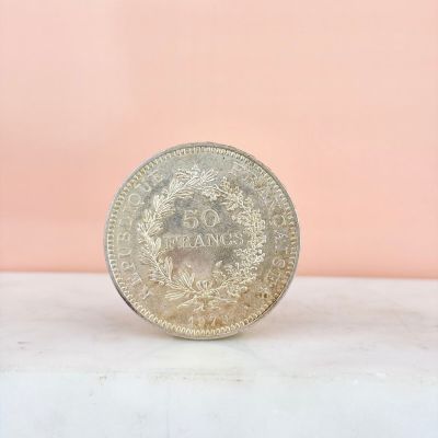 an image of a silver coin on a table