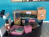 a black box filled with christmas decorations on the floor