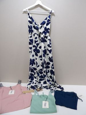 a white and blue dress and a pink and blue dress on a hanger