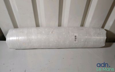 a close up of a roll of plastic on a table