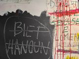 a blackboard with writing on it in a room