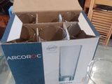 a box of empty glasses sitting on a table