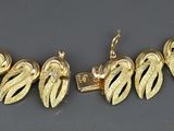 yellow gold plated necklace and earring set with leaf design