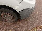 a car that has a flat tire on the street