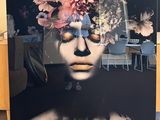 a picture of a woman with flowers on her head