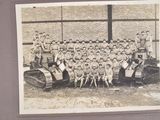 a black and white photo of a group of children posing for a picture