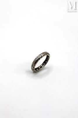 a close up of a ring on a white surface