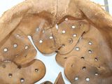 an image of a baseball glove with holes in it
