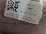 a label on the back of a sweater that says welcome