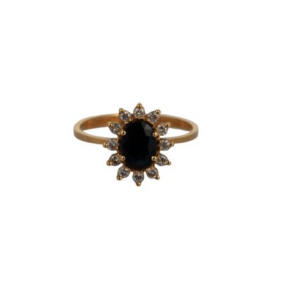 a gold ring with a black stone surrounded by white diamonds