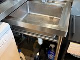 a washer and a dryer in a small kitchen