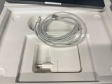 a white box with a charger and a cable in it