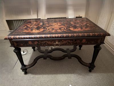 a coffee table with a brown and black design on it