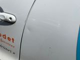 a close up of a car door handle with a sticker on it