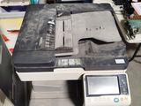 a printer sitting on top of a desk in a room