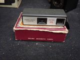 a camera sitting on top of a box on the floor