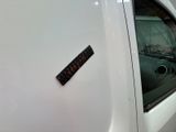 a sticker on the side of a white car