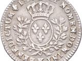 a close up of a coin with a crown on top of it