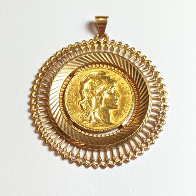 l'image d'une pièce d'or sur laquelle figure une femme