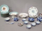 many plates and bowls that are sitting on a table
