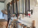 many tools hanging on the wall in the garage