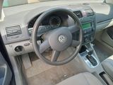 dashboard of a car with a steering wheel and dashboard controls