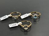 trois bagues en or ornées de topazes bleues et de diamants