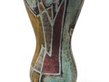 a vase with a design on it on a white surface
