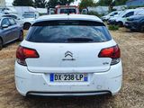 a white car that is parked in a parking lot