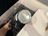 a person opening a box with a light inside of it