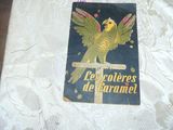a picture of a book on a bed with a bird on it