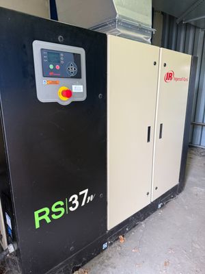 a close up of an air compressor in a warehouse
