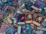 many different types of cards are scattered on a table
