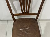 a brown chair with a star on the back of it