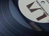 a vinyl record with a black and white label on it