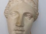 marble bust of a woman with a turban on her head